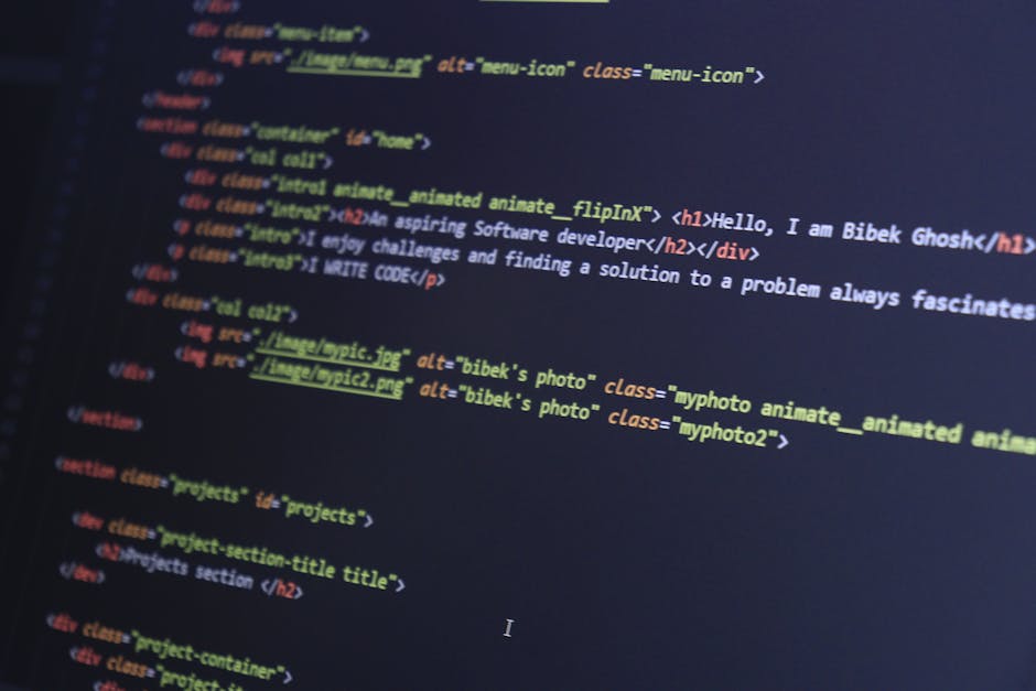 A close-up view of a computer screen displaying lines of colorful code with various syntax highlighting in shades of blue, green, yellow, purple, and orange. The background of the screen is dark, and 